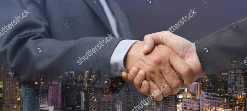 stock-photo-double-exposure-of-business-men-handshake-and-city-night-business-agreement-concept-twilight-sky-519342997